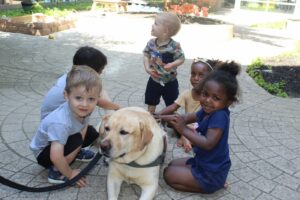 students with a dog from Buckeye Paws 