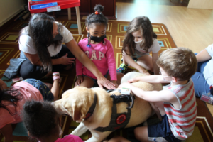 students with a dog from Buckeye Paws