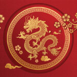 On a red background is a red circle inside of which is a stylized gold drawing of a dragon to symbolize Lunar New Year 2024, which is the Year of the Dragon.