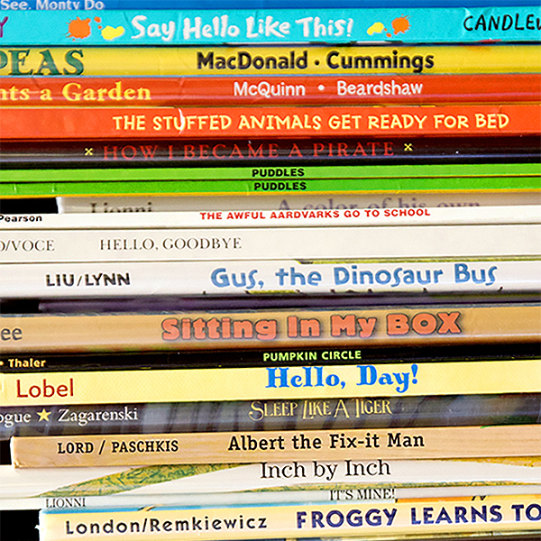 A stack of 20 or so children's books with the spines out showing the book titles