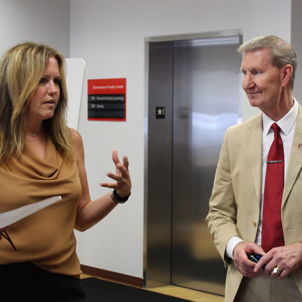 Schoenbaum Family Center Executive Director Dr. Laura Justice, left, talks to Ohio State University President Walter "Ted" Carter